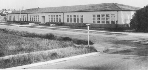Vintage black-and-white photograph of the empty lot across from Overland Elementary 1940, to become the Riddick Site.
